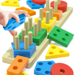 Colorful geometric shape sorting toy with wooden blocks and a hand placing a blue block.