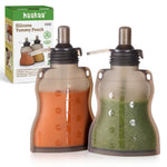 Two haakaa silicone yummy pouches with colorful liquids and packaging in the background.