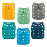 Set of six colorful cloth diapers with button closures on a white background