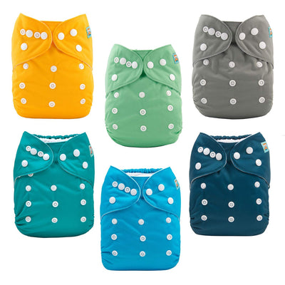 Set of six colorful cloth diapers with button closures on a white background