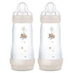 Two baby bottles with decorative elements on a white background