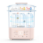 Pink and clear baby bottle sterilizer with妈粉颜 branding on a white background