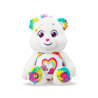 White plush toy with rainbow accents on a white background