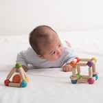 PlanToys Wooden Clutching Triangle Baby Toy with Gentle Sound in Two-Toned Ball (5244) | Sustainably Made from Rubberwood and Non-Toxic Paints and Dyes