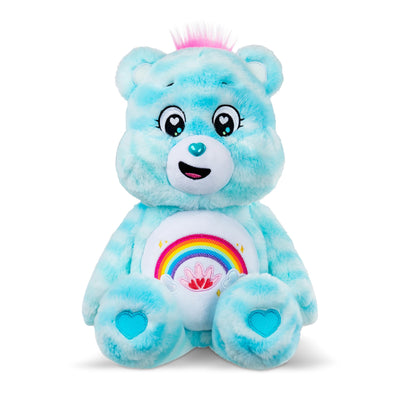 Blue plush bear with rainbow design on a white background