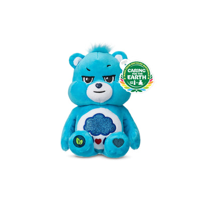Blue plush bear with a badge on a white background