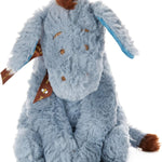 Plush toy donkey with a brown mane on a white background