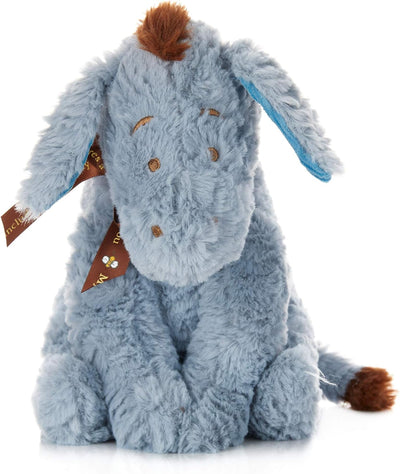 Plush toy donkey with a brown mane on a white background