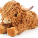 Plush toy Highland cow on a white background