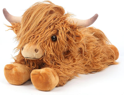 Plush toy Highland cow on a white background