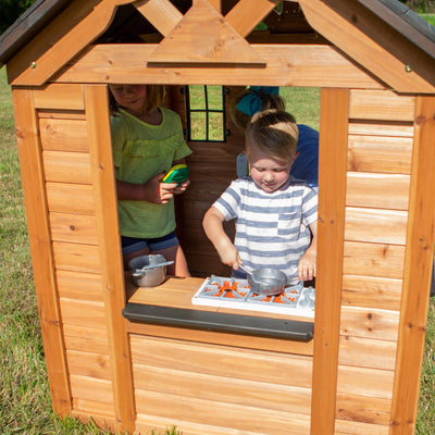 Backyard Discovery Sweetwater Cedar Wooden Kids Playhouse Cottage with Play Kitchen, Snack Bar, Half Door, Toy Phone, Windows, Flowerpot Holders, and Working Doorbell for Outdoor Imaginative Play