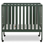 Dream On Me Jett Mini Folding Baby Crib in Olive, GreenGuard Gold & BSA, Lightweight & Portable, Patented Flat Folding System for Small Spaces & Travel, 1.5” Mattress Pad, 3 Heights, Safe Wheels