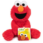 Red plush toy with a tag on a white background