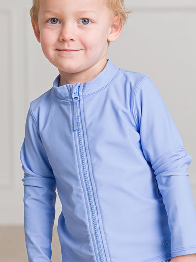 RuffleButts UPF50+ Sun Protective Unisex Long Sleeve Full Zip Rash Guard - Periwinkle Blue, 18-24m