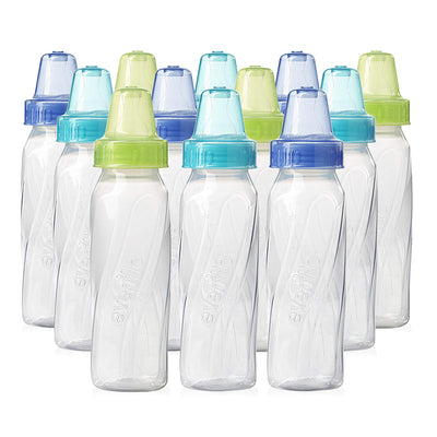 Set of clear baby bottles with colorful caps on a white background