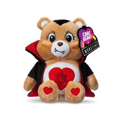 Plush toy bear in a vampire costume with a heart design, wearing a Care Bears tag.