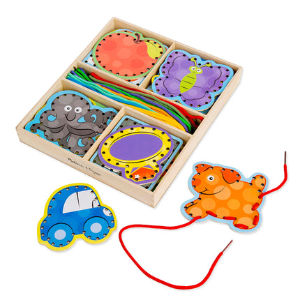 Wooden educational toy with colorful animal shapes and a pull toy on a white background