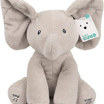 Plush elephant toy with a tag on a white background