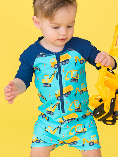 RUGGEDBUTTS Baby/Toddler Boy Swimsuit, One Piece Zipper Rash Guard Sunsuit with UPF 50+ Sun Protection - Under Construction, 6-12m