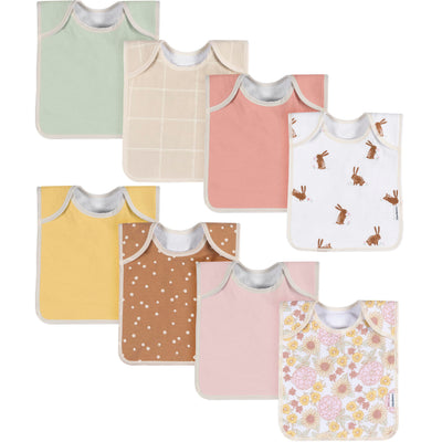 Collection of colorful baby bibs with various patterns on a white background