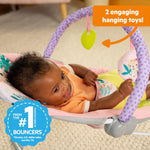 Bright Starts Pink Vibrating Baby Bouncer, Removable Toy Bar with 2 Toys, Nonslip Feet, 0-6 Months Up to 20 lbs (Wildflower Wonders)