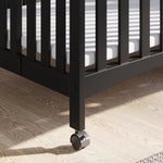 Child Craft London Mini Compact Folding Portable Crib with 2” Crib Mattress and 2 Easy Roll Locking Wheels, Durable Pine Wood Construction (Ebony Black)