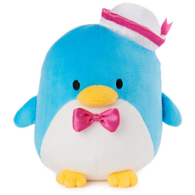 Plush penguin toy with a pink bow tie and hat on a white background