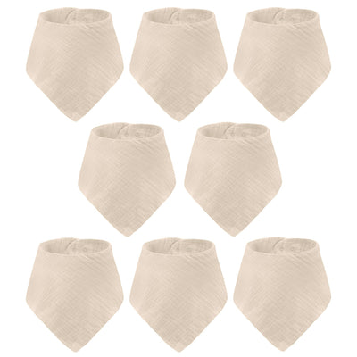 Set of eight beige baby bibs on a white background