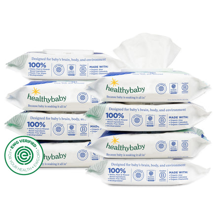 Multiple packages of healthybaby wipes stacked on a white background