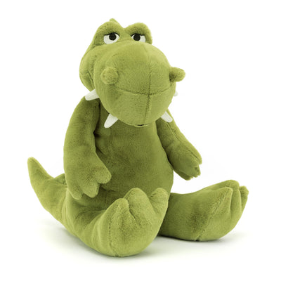 Green plush toy dinosaur on a white background