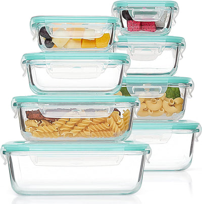 Set of glass food storage containers with teal lids on a white background