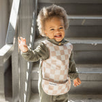 Tiny Twinkle Mess Proof Baby Bib - Waterproof Baby Apron - Machine Washable - PVC, BPA, & Phthalate Free - Great Travel Bib for Baby Eating - Baby Food Bibs (Brown Checkers, Large 2-4 Years)