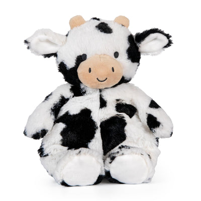 Plush cow toy with black and white pattern on a white background