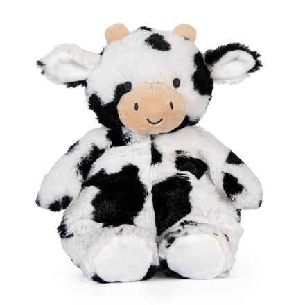 Plush cow toy with black and white pattern on a white background
