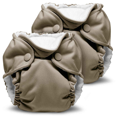 Beige cloth diapers with white interiors on a white background