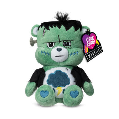 Plush toy resembling a monster with a tag indicating it is from the Care Bears x Monsters collection.