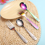 Set of colorful cutlery with bear designs on a woven mat