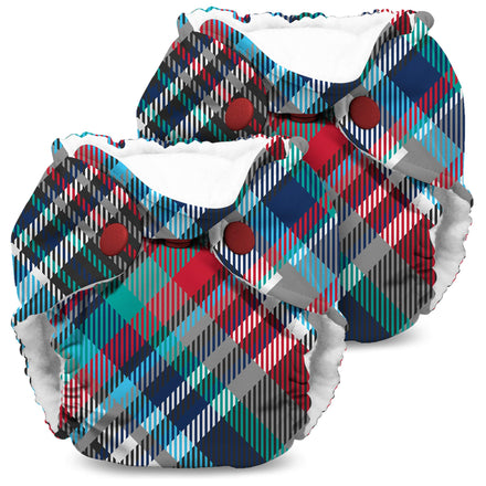 Two colorful plaid-patterned baby diapers on a white background