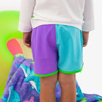 RUGGEDBUTTS Boys UPF50+ Sun Protected Stretch Dolphin Hem Swim Trunks - Neon Bright Aqua Color Block, 3-6m