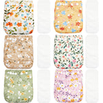 Set of six floral-patterned cloth diapers on a white background