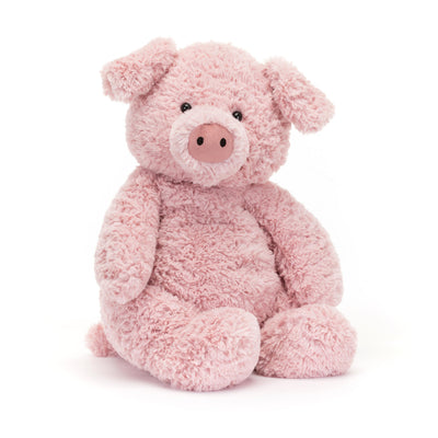 Pink plush pig toy on a white background