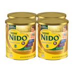 Four cans of Nestle Nido Excella Gold toddler milk beverage on a white background