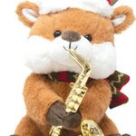 Plush reindeer toy with a saxophone, Santa hat, and Christmas scarf on a white background