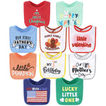 Collection of colorful baby bibs with various prints on a white background