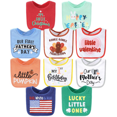 Collection of colorful baby bibs with various prints on a white background