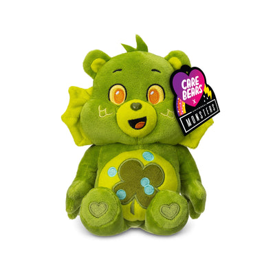 Green plush bear with a heart and clover design, wearing a 'Care Bears x Monstars' tag.