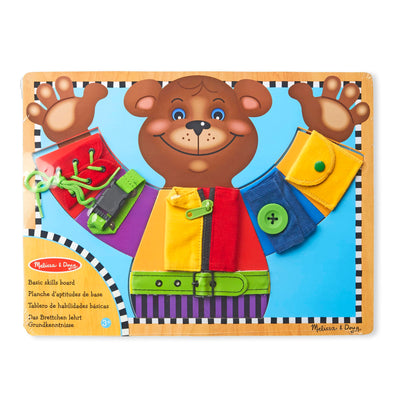 Children's educational board with a bear character and various items on a white background