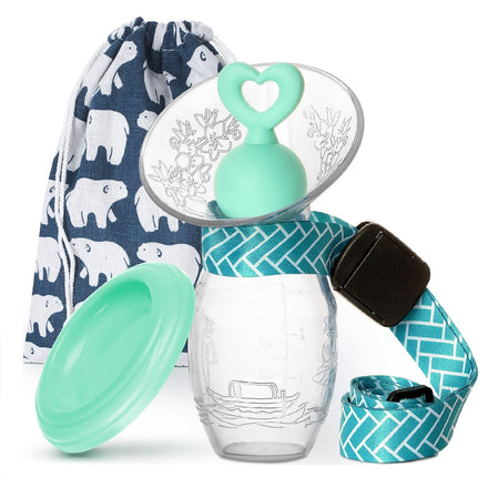 Clear baby bottle with green cap and blue strap, featuring a patterned bag in the background.