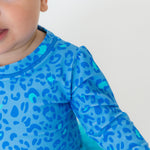 RuffleButts Baby Girls UPF 50+ Sun Protection Tulle Skirted Long Sleeve One Piece Rash Guard Swimsuit - by The Seaside, 12-18m