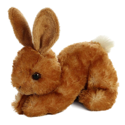 Brown plush rabbit toy on a white background